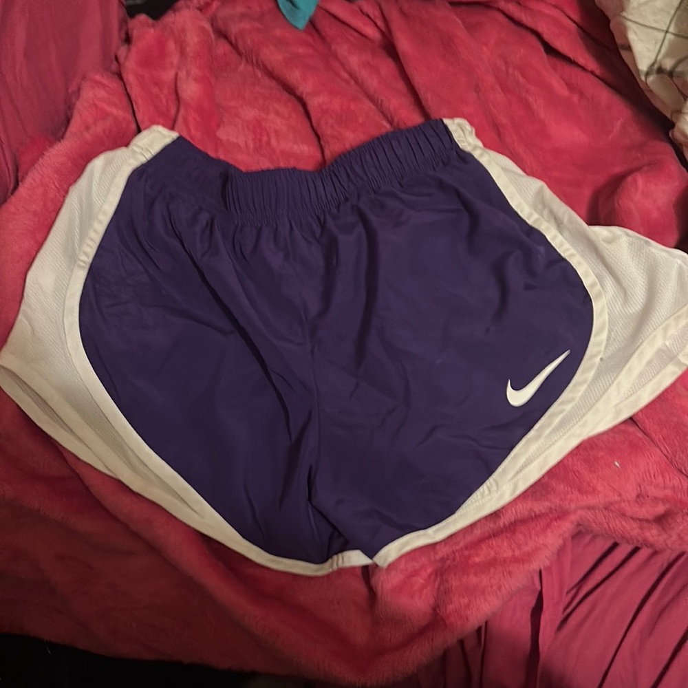 Nikr gently used woman’s size small jogging shorts purple and white in color